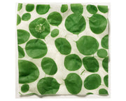 white reusable food wrap with bright leafy green design