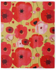 beeswax food wrap in a bright pink and red poppies design