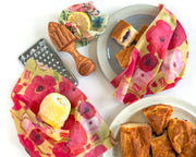 lemon, juicer, grater and blueberry bread wrapped in natural reusable food wraps
